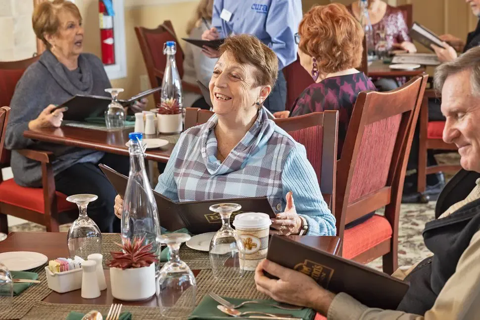 a woman holding a menu