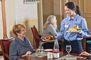 a waitress serving food